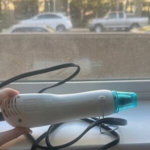 White Handheld Heat Gun with Teal Nozzle